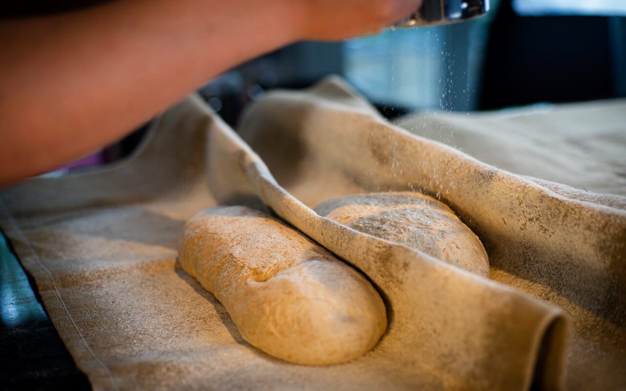 French Country Bread Proofing In Bakers Couche