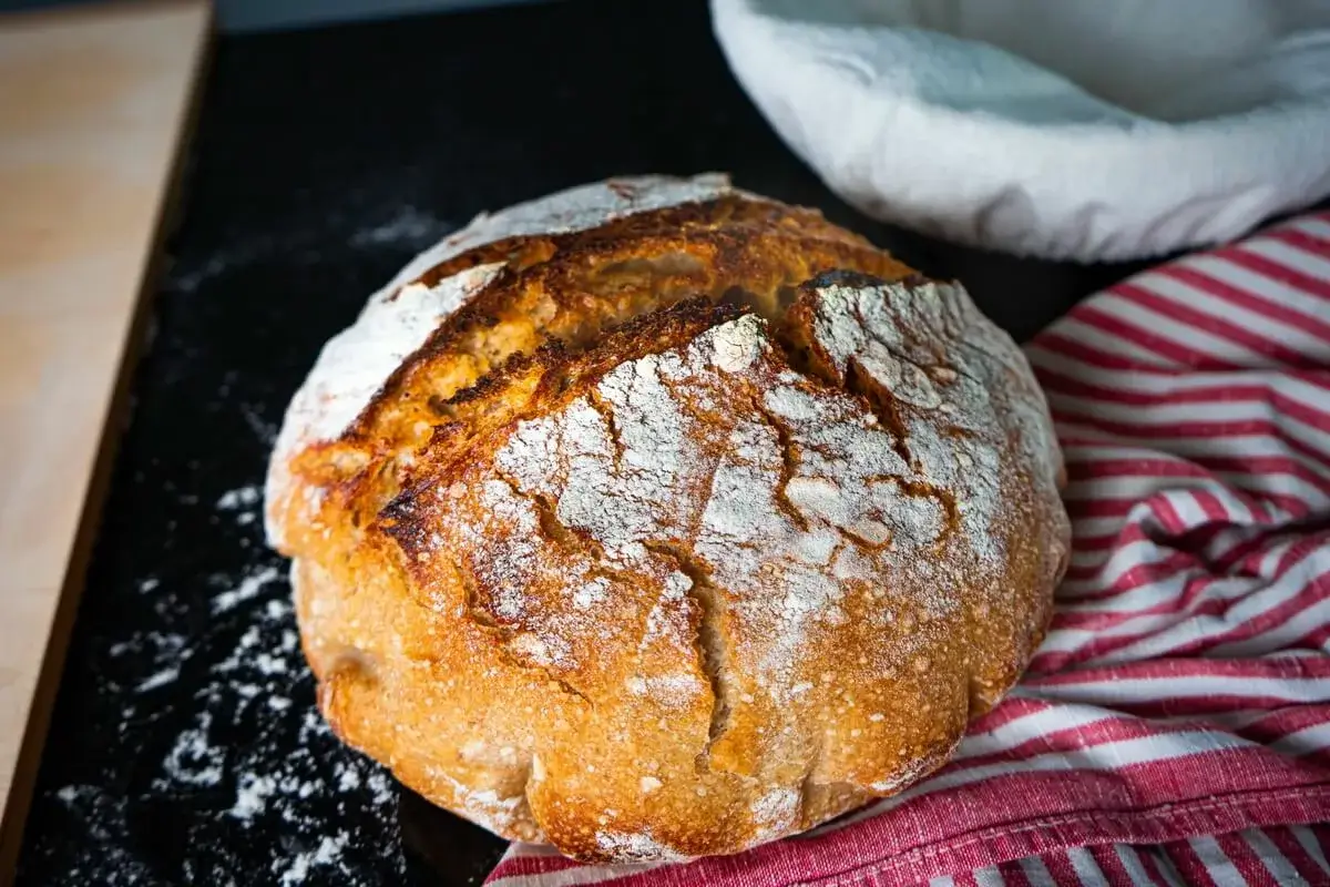 https://delightbaking.com/wp-content/uploads/2019/08/Sourdough-Bread-Baked-In-A-Dutch-Oven-1200x800.webp