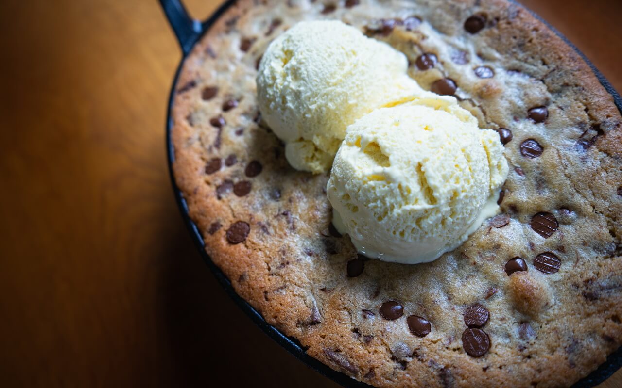Soft Baked Chocolate Chip Skillet Cookie Close up With Ice Cream