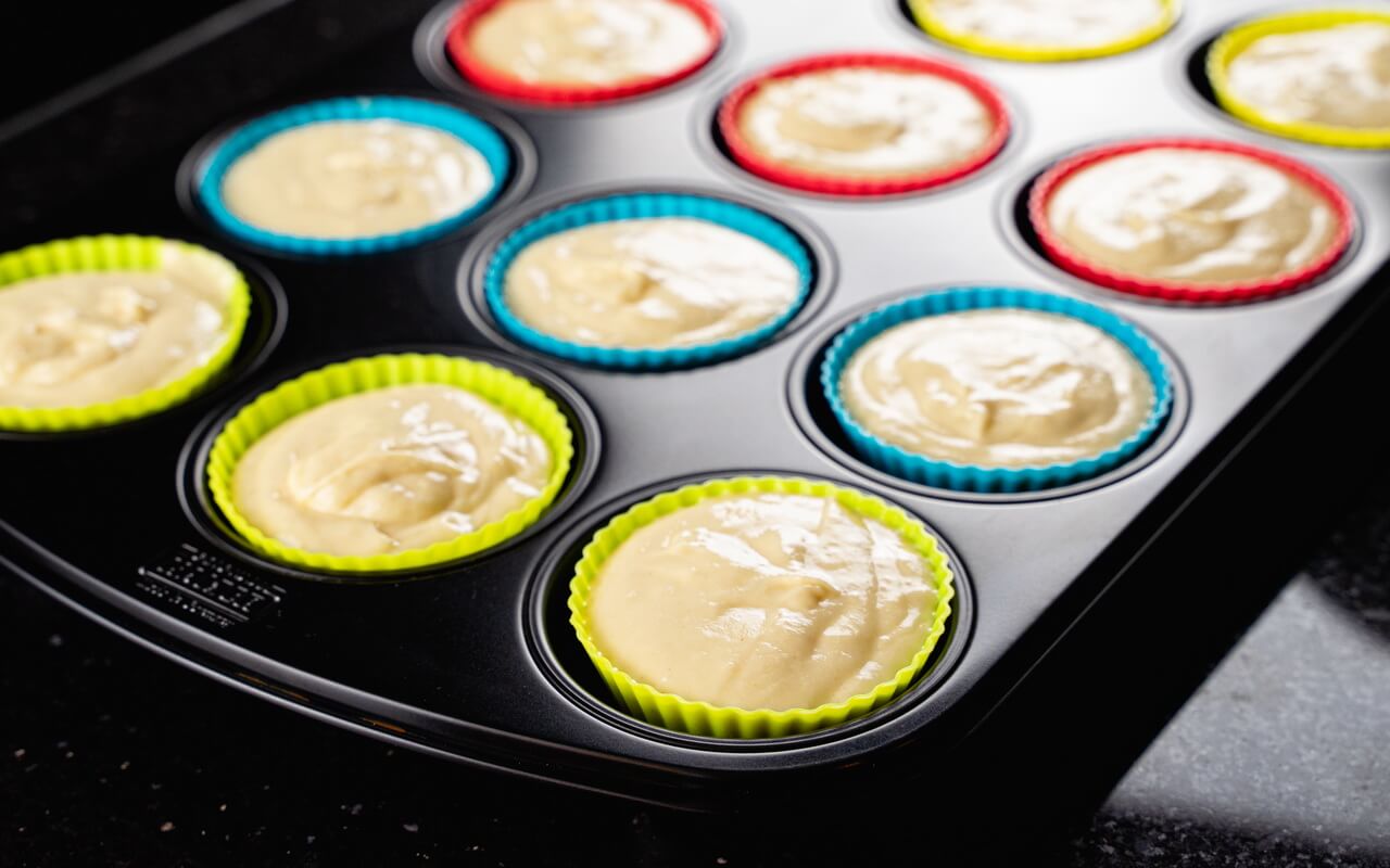 Basic Muffin Recipe With Sugar Glaze Muffin Pan Filled With Dough