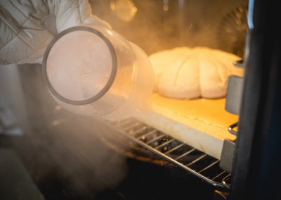 Pumpkin Spice Sourdough Bread Puring In Water For Steam