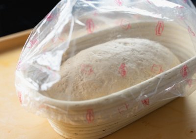 Big Sourdough Bread Covered With Plastic Bag