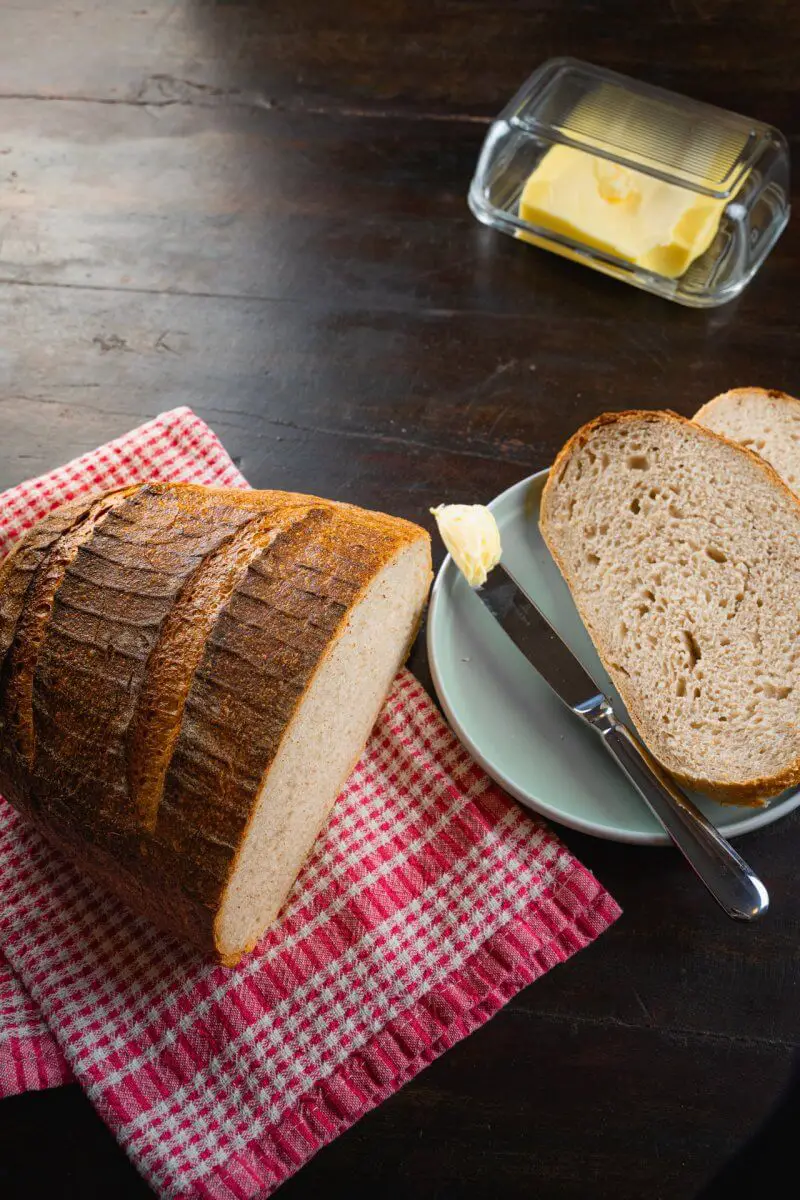 Big Sourdough Bread With Butter Vertical